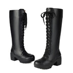 Black lace-up knee high platform boots on a white background