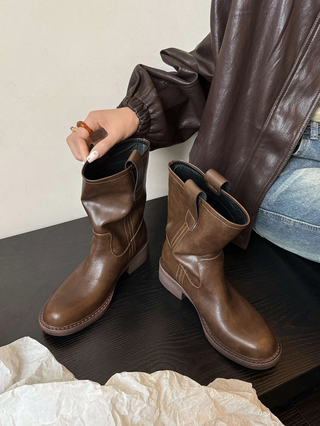 Brown leather mid calf western boots styled with jeans
