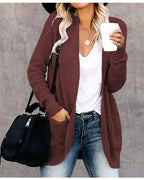 Rust red long open front cardigan worn with jeans