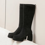 Black platform knee high boots with chunky block heel, side view