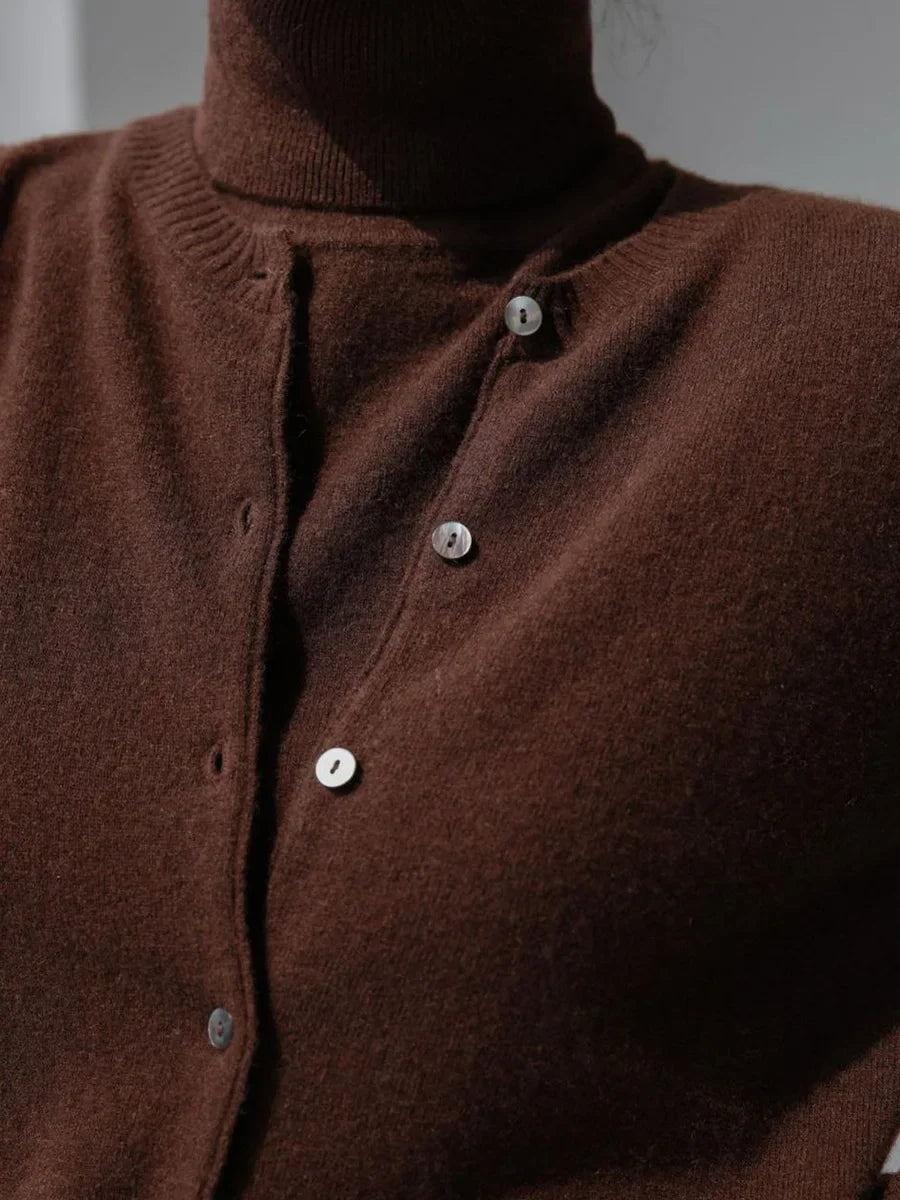 Close-up of the buttons on a chocolate brown knit cardigan